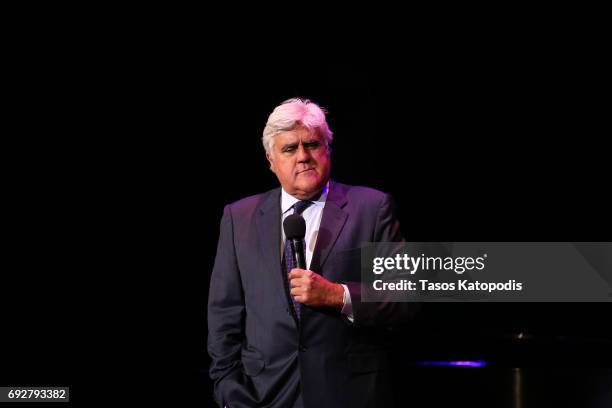 Jay Leno performs on stage during the National Night Of Laughter And Song event hosted by David Lynch Foundation at the John F. Kennedy Center for...