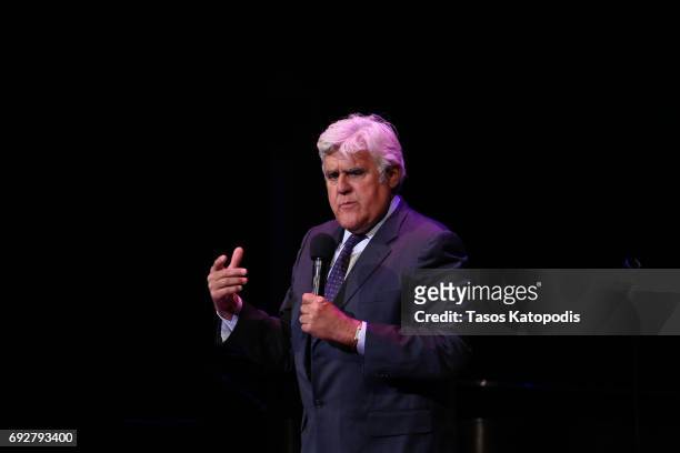 Jay Leno performs on stage during the National Night Of Laughter And Song event hosted by David Lynch Foundation at the John F. Kennedy Center for...