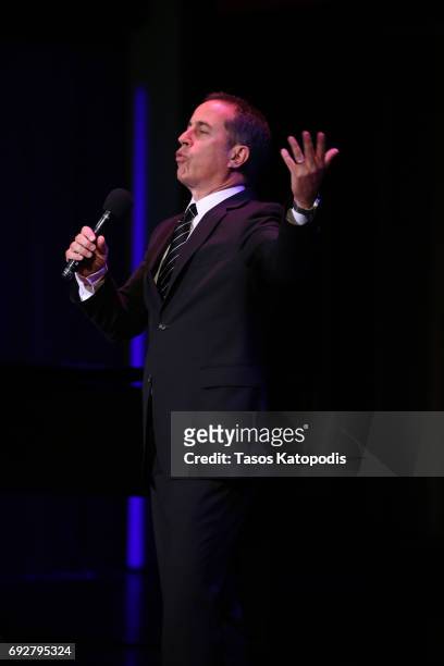 Jerry Seinfeld performs on stage at the National Night Of Laughter And Song event hosted by David Lynch Foundation at the John F. Kennedy Center for...