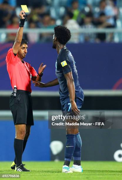 Referee Mohammed Abdullah Hassan awards a yellow card to Josh Onomah of England during the FIFA U-20 World Cup Korea Republic 2017 Quarter Final...