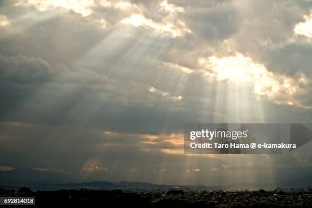 sunbeam on the beach and town in kamakura, fujisawa and chigasaki cities and shonandgaira mountain in hiratsuka city in kanagawa prefecture in the sunset - chigasaki beach stock pictures, royalty-free photos & images