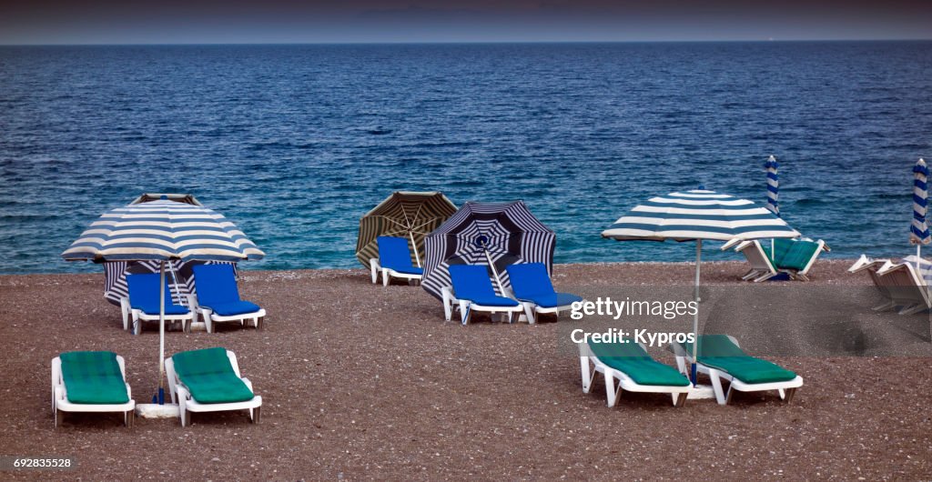 Europe, Greece, Rhodes Island, View Of Chairs On Deserted Greek Beach