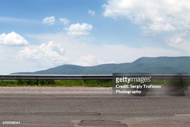 road on mountain pass, side view - country roads stock-fotos und bilder