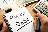 Note with words pay off debt concept.