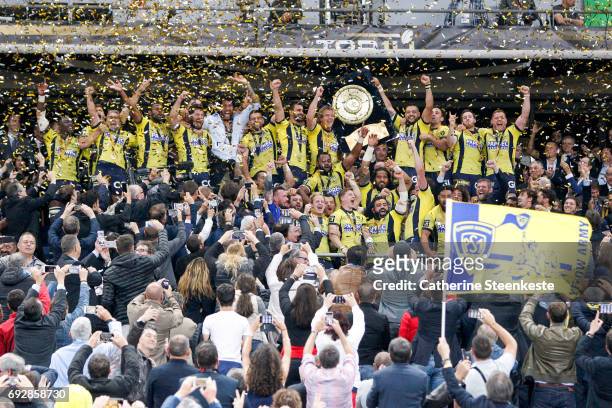 Damien Chouly of ASM Clermont Auvergne and his teammates lift the Bouclier de Brennus trophy after winning the Top 14 final match between ASM...