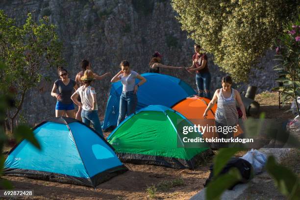 young girl friends tent camping at kelebek valley near fethiye mugla turkey - mugla province stock pictures, royalty-free photos & images
