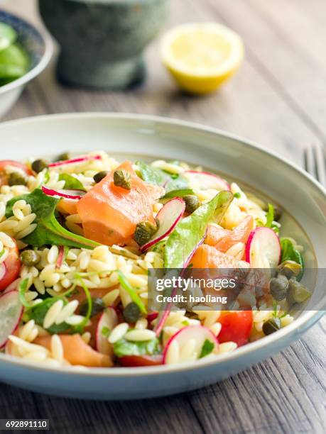 healthy orzo salad with smoke salmon - smoked salmon stock pictures, royalty-free photos & images