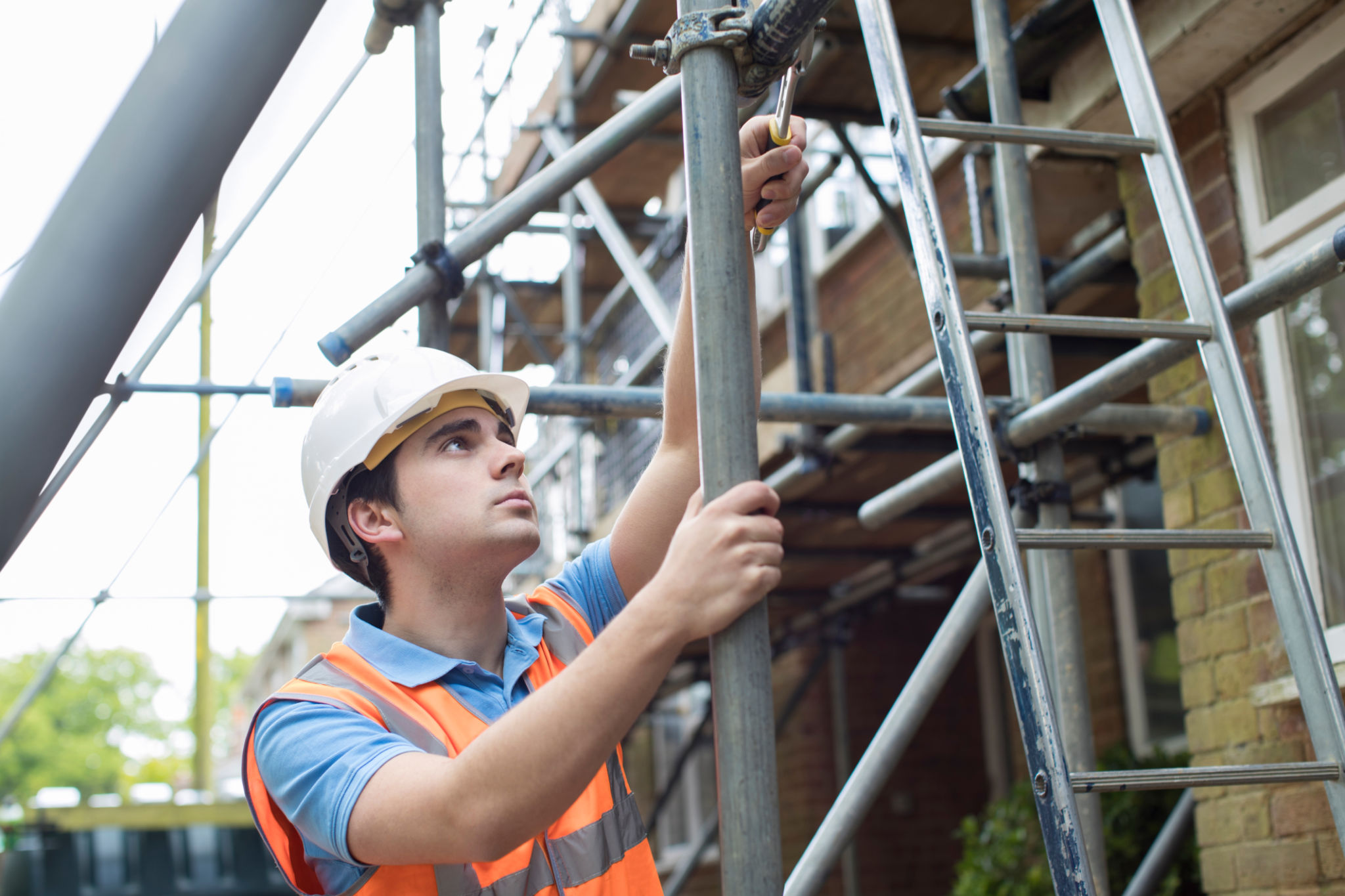 worker inspecting scaffolding