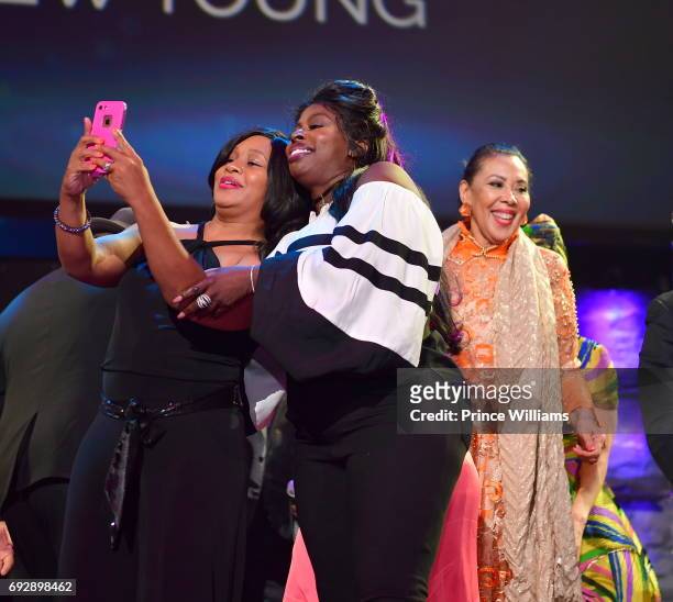 Angie Stone and Carolyn Young attend the 2017 Andrew Young International Leadership awards and 85th Birthday tribute at Philips Arena on June 3, 2017...