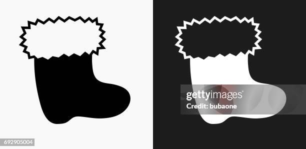 christmas sock icon on black and white vector backgrounds - white socks stock illustrations