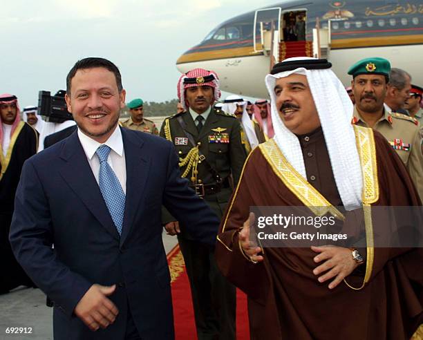 Bahrains Emir Sheikh Hamad bin Issa al-Khalifa receives King Abdullah II of Jordan at Manama airport January 9, 2002 in Abu Dhabi, UAE. The Jordanian...