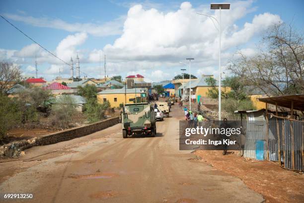 Baidoa, Somalia A convoy of military vehicles of the African Union is driving through a city in Somalia. Street scene of Baidoa on May 01, 2017 in...