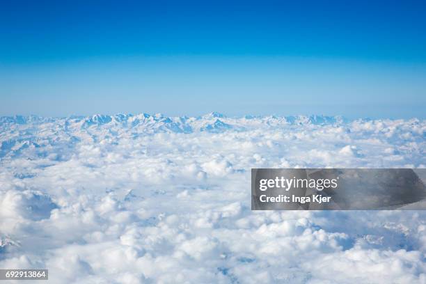 Zurich, Switzerland View from an airplane on the cloud cover over the Swiss Alps on April 10, 2017 in Zurich, Switzerland.