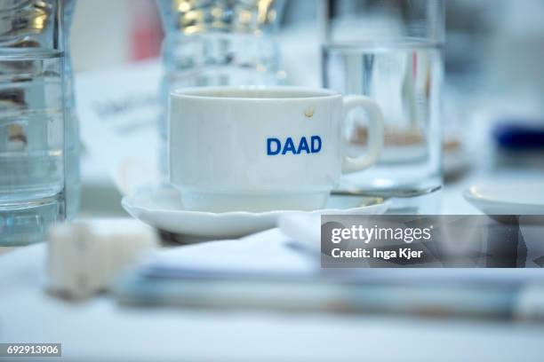 Cairo, Egypt A coffee cup on which the logo of the German Academic Exchange Service is printed is on a table during the 'DAAD High-Level Experts...