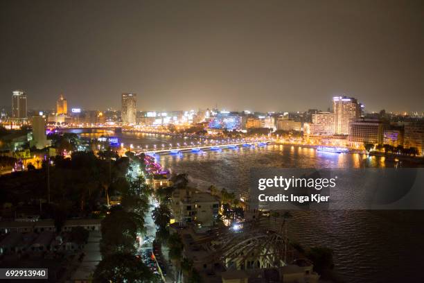 Cairo, Egypt View of the Nile and old town of Cairo at night on April 10, 2017 in Cairo, Egypt.