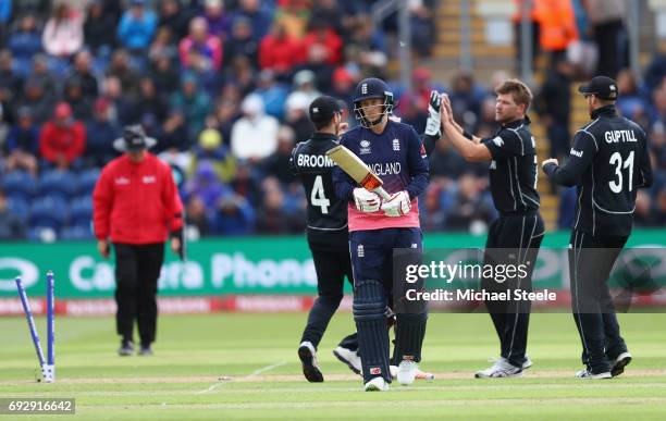 Joe Root of England heads to the pavillion after playing on off the bowling of Corey Anderson for 64 runs during the ICC Champions Trophy match...