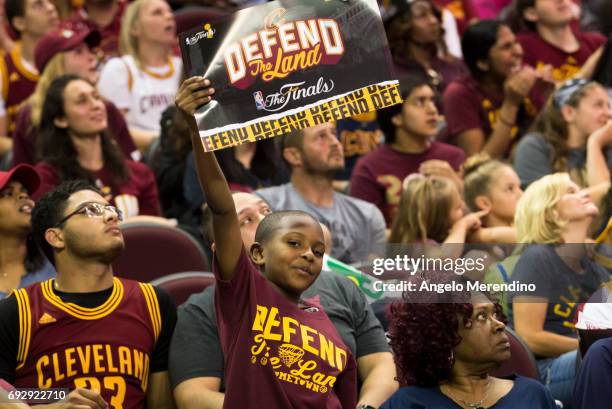 Young Cavs fan holds a sign inside The Quicken Loans Arena for an NBA Finals Game Two watch party between the Cleveland Cavaliers and the Golden...