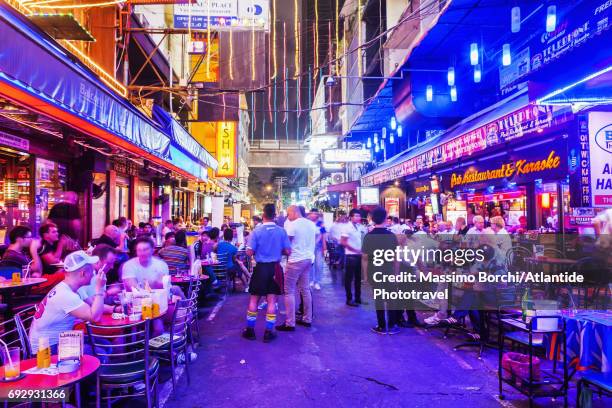 the red light district of patpong - bangkok patpong stock pictures, royalty-free photos & images