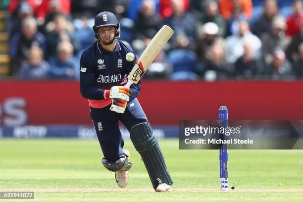 Jos Buttler of England pulls a delivery to the legside during the ICC Champions Trophy match between England and New Zealand at the SWALEC Stadium on...