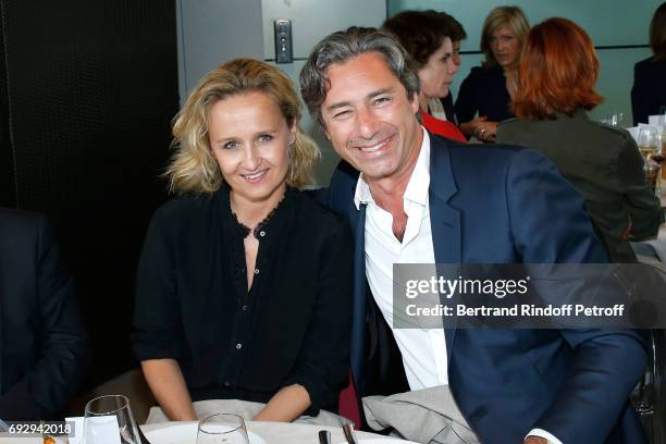 Journalist Caroline Roux and her companion General Director of Facebook France, Laurent Solly attend the "France Television" Lunch during the 2017...