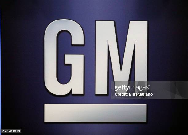 The General Motors logo is shown on the podium at the company's annual meeting of shareholders June 6, 2017 in Detroit, Michigan. The results of a...