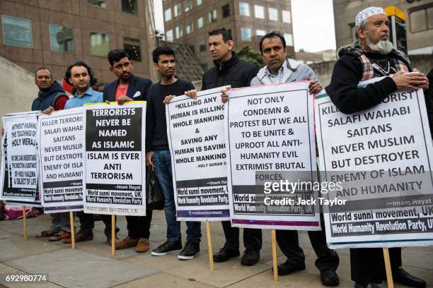 Members of the World Sunni Movement hold placards during a demonstration on London Bridge following the June 3rd terror attack on June 6, 2017 in...