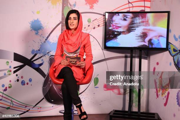 Afghan presenter records her musical TV program at the first women's TV channel Zan TV station in Kabul, Afghanistan on June 6, 2017.