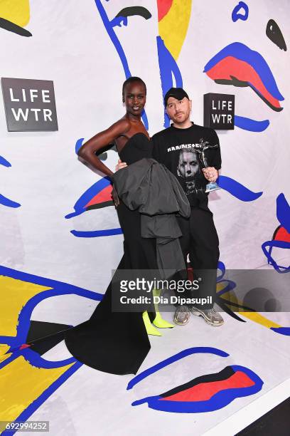 Model Alek Wek and International Award Winner Demna Gvasalia for Vetements and Balenciaga pose on the LIFEWTR Winner's Walk at the CFDA Awards 2017...