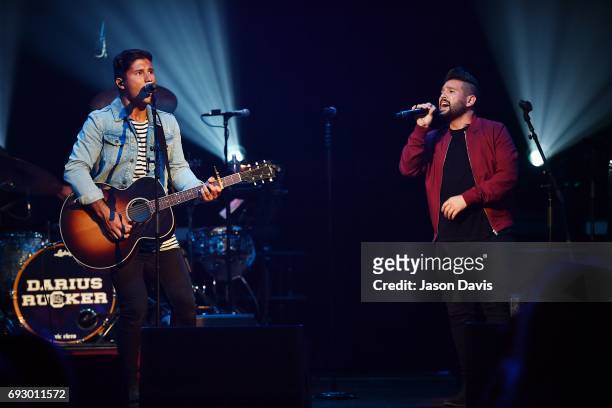 Recording Artists Dan Smeyers and Shay Mooney of Dan + Shay perform onstage during 8th Annual Darius and Friends concert at Ryman Auditorium on June...