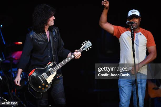 Recording Artists Darius Rucker and Tommy Thayer perform onstage during 8th Annual Darius and Friends concert at Ryman Auditorium on June 5, 2017 in...