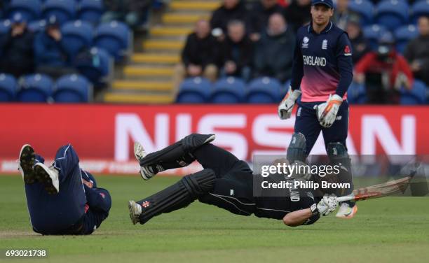 Neil Broom of New Zealand collides with Jason Roy of England during the ICC Champions Trophy match between England and New Zealand at Swalec stadium...