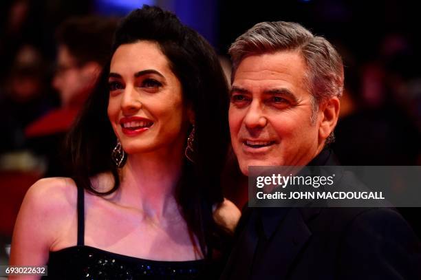File photo dated February 11, 2016 shows US actor George Clooney and his wife Amal arrive at the 66th Berlinale Film Festival in Berlin. George and...