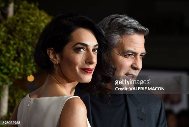 File photo dated February 1, 2016 shows actor George Clooney and wife Amal at the Regency Village Theatre, in Westwood, California. George and Amal...