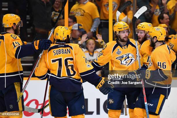 Filip Forsberg of the Nashville Predators celebrates with teammates after his empty net goal during the third period of Game Four of the 2017 NHL...