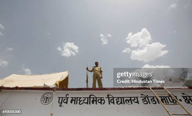 MUMBAI, INDIA RAMSHARAN YADAV OF PROVINCIAL ARMED CONSTABLE GUARD FROM THE TOP OF THE PRIMARY SCHOOL IN DHONDAMAFI VILLAGE OF CHITRAKOOT DISTRICT IN...