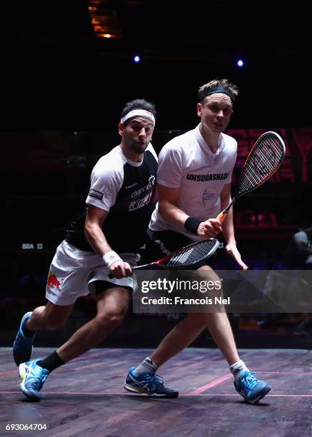 Mohamed El Shorbagy of Egypty competes against James Willstrop of England during day one of the PSA Dubai World Series Finals 2017 at Dubai Opera on...