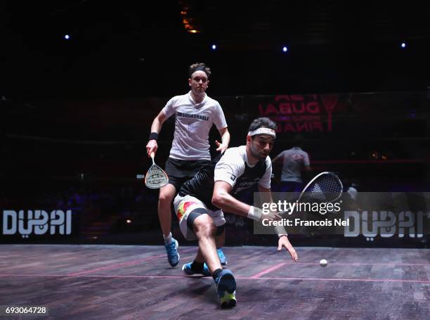 Mohamed El Shorbagy of Egypty competes against James Willstrop of England during day one of the PSA Dubai World Series Finals 2017 at Dubai Opera on...