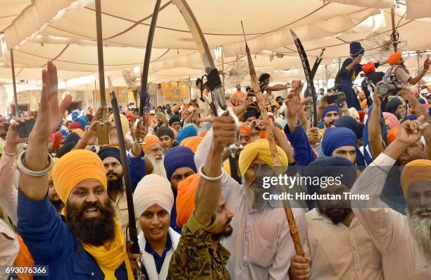Sikh radical activists raising the pro-Khalistan slogans on the 33rd anniversary of Operation Blue Star at Akal Takht Sahib, Golden Temple, on June...