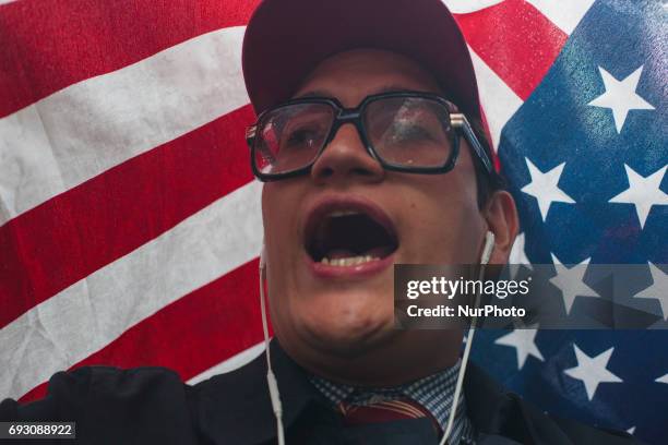 People protest at against CUNYs commencement speaker pick, Muslim Linda Sarsour in New York, US, on 5 June 2017.After months of campaigning to...