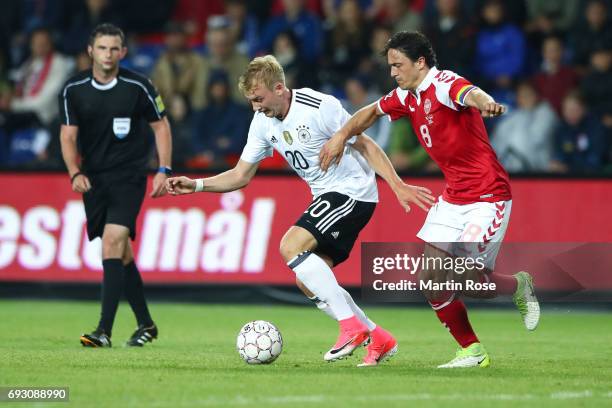 Julian Brandt of Germany and Thomas Delaney of Denmark battle for the ball during the international friendly match between Denmark v Germany on June...