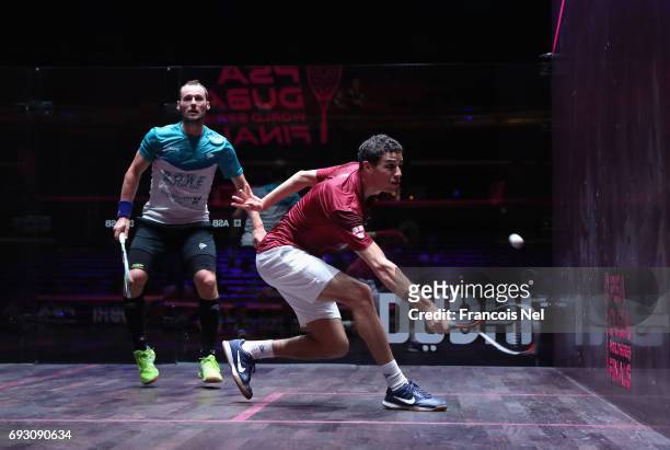 Ali Farag of Egypt competes against Gregory Gaultier of France during day one of the PSA Dubai World Series Finals 2017 at Dubai Opera on June 6,...
