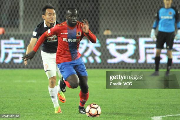 Cheick Tiote of Beijing Enterprises vies for the ball during 2017 China League One round 6th match between Beijing Enterprises Group F.C. And Beijing...