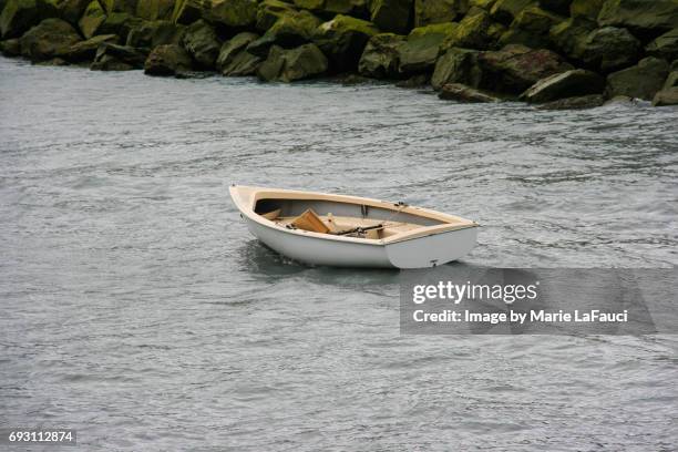 empty runaway boat with no captain - abandoned boat stock pictures, royalty-free photos & images