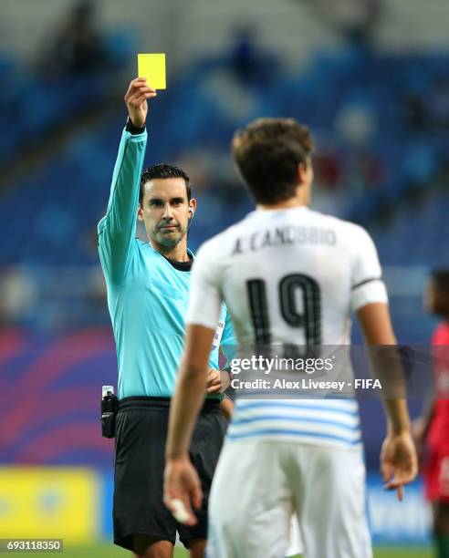 Referee Cesar Ramos shows a yellow card to Agustin Canobbio of Uruguay during the FIFA U-20 World Cup Korea Republic 2017 Quarter Final match between...