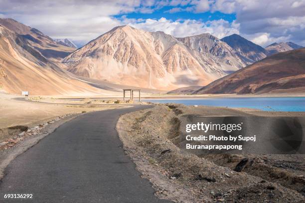 road view of pangong lake with blue sky in summer ,leh ladakh,north india - 2016 243 stock pictures, royalty-free photos & images