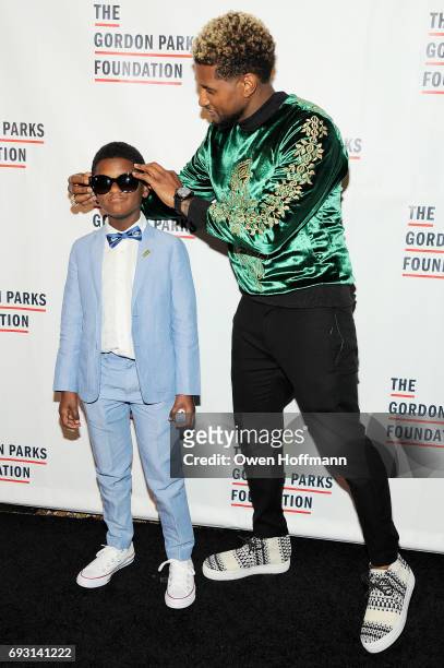 Naviyd Ely Raymond and singer-songwriter Usher attend the Gordon Parks Foundation Awards Dinner & Auction at Cipriani 42nd Street on June 6, 2017 in...