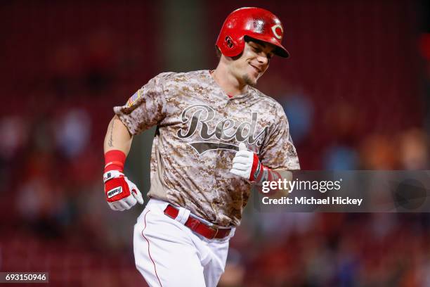 Scooter Gennett of the Cincinnati Reds rounds the bases after hitting his fourth home run against the St. Louis Cardinals at Great American Ball Park...