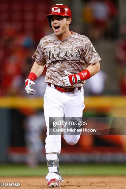 Scooter Gennett of the Cincinnati Reds runs the bases after hitting his fourth home run of the game in the eighth inning against the St. Louis...