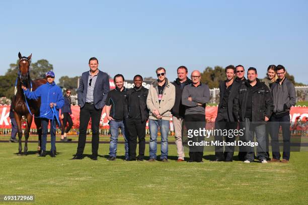 Former AFL footballer and part owner Michael Gardiner poses with Bellegano and sponsors after winning the Elaren Security Services Handicap at...