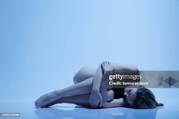 beautiful girl on the floor at the studio - underweight stock pictures, royalty-free photos & images